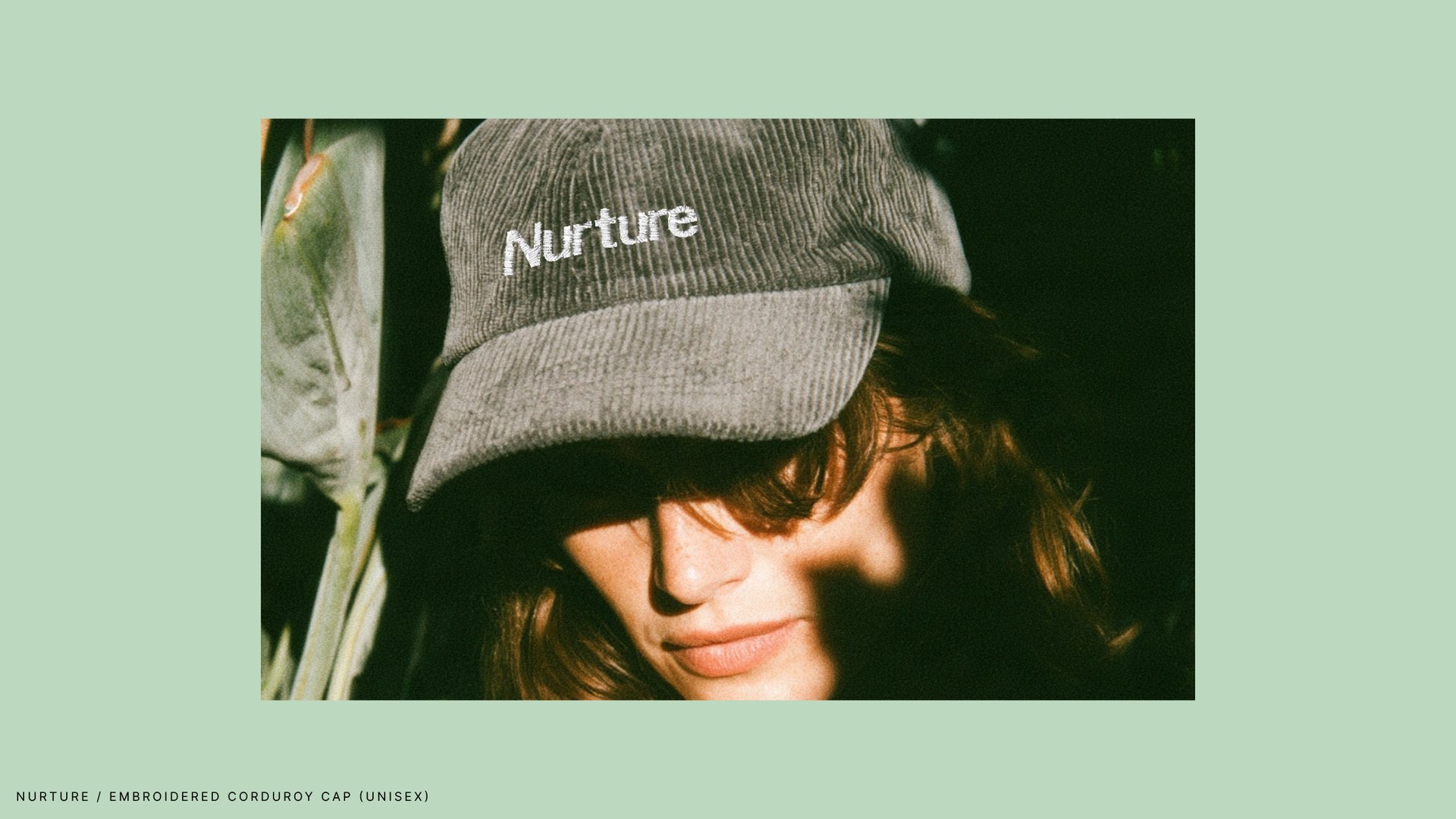 Grey corduroy cap with the Nurture wordmark embroidered on the crown